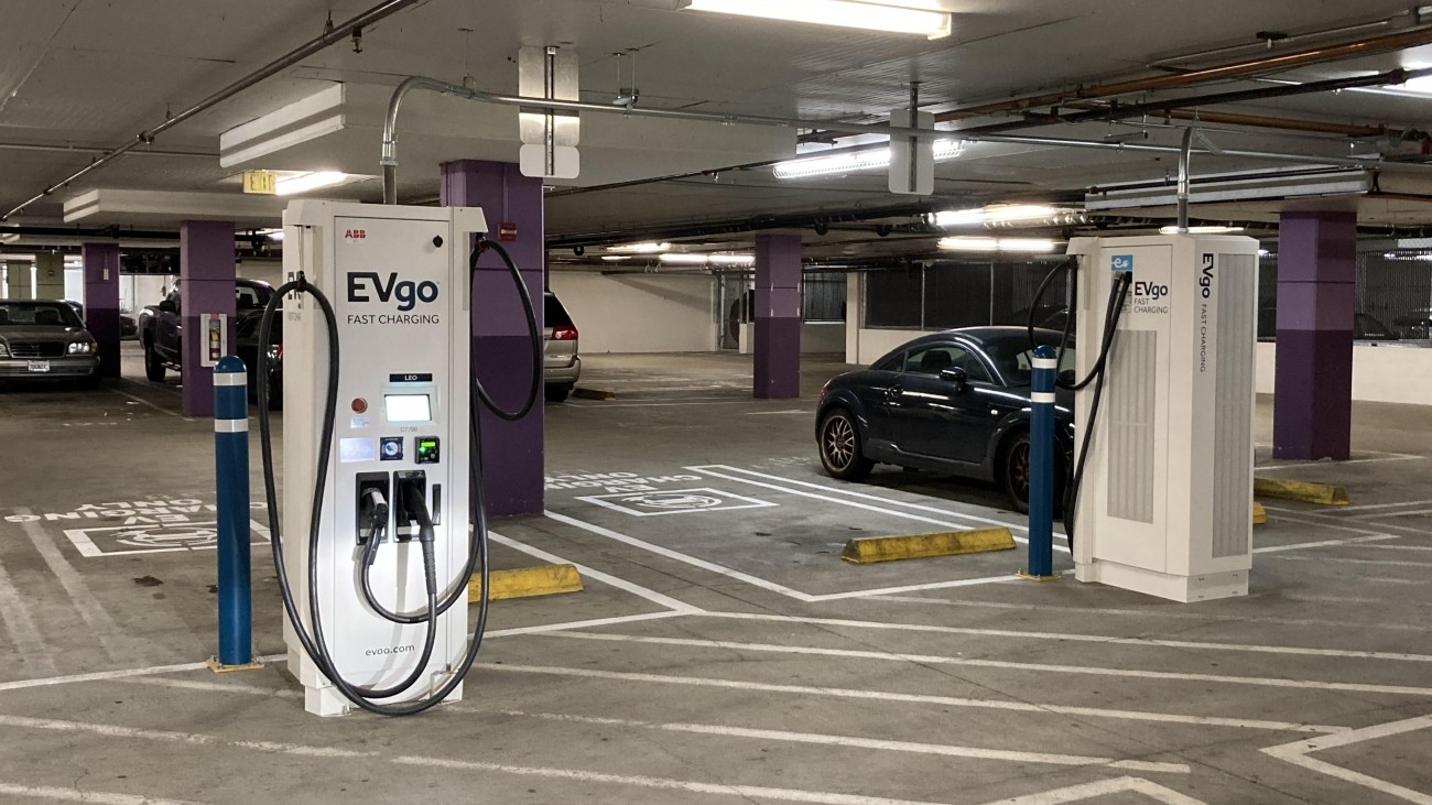 Electric vehicle charging stations in a parking garage 