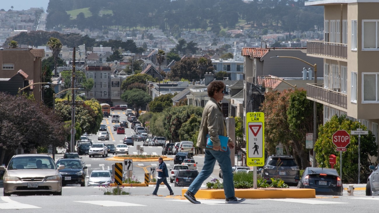 Image of pedestrian crossing street