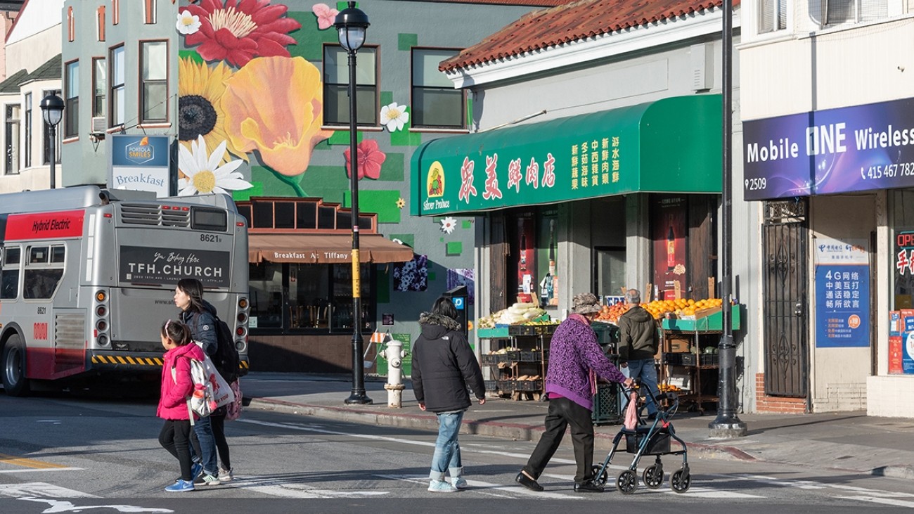 People crossing the street on San Bruno Ave in San Francisco