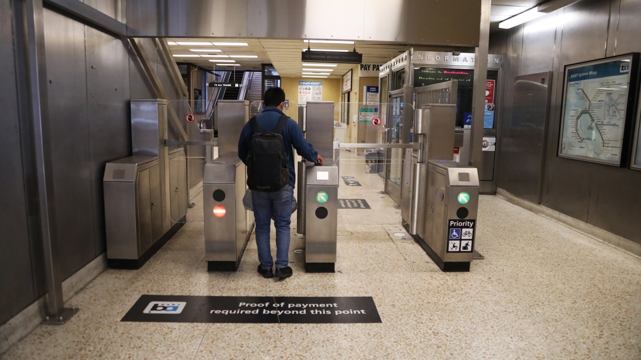 BART rider going through updated faregate. 