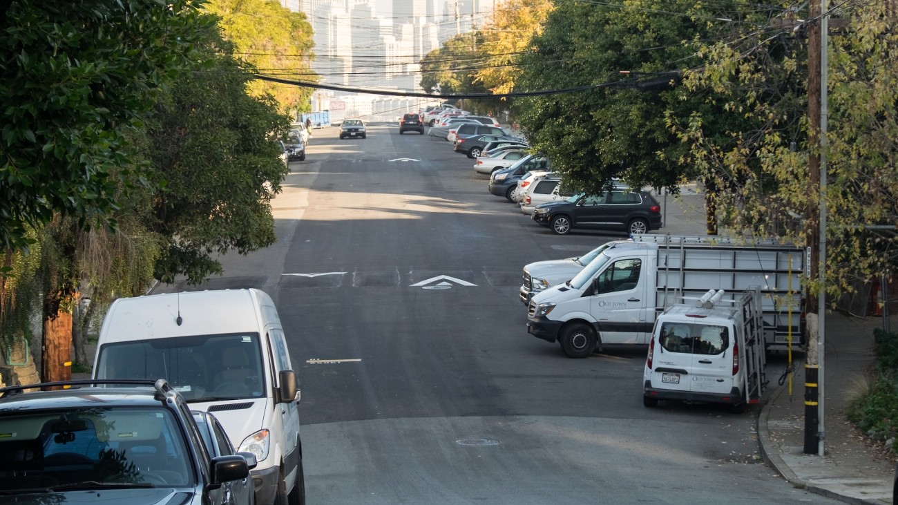 speed humps along road with cars parked