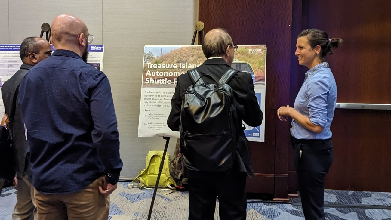 TA staff speaking with participants about the Treasure Island Autonomous Shuttle Pilot 