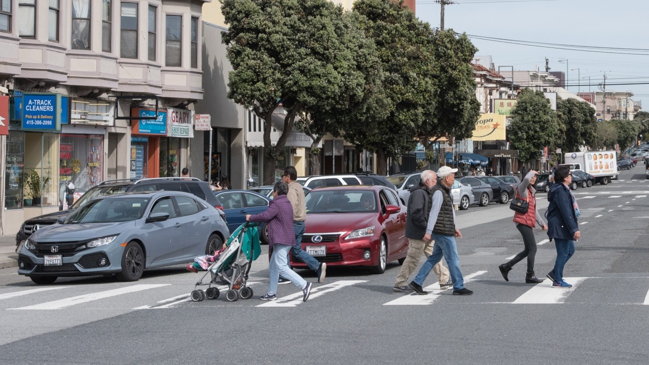 Group of pedestrians crossing Geary Street