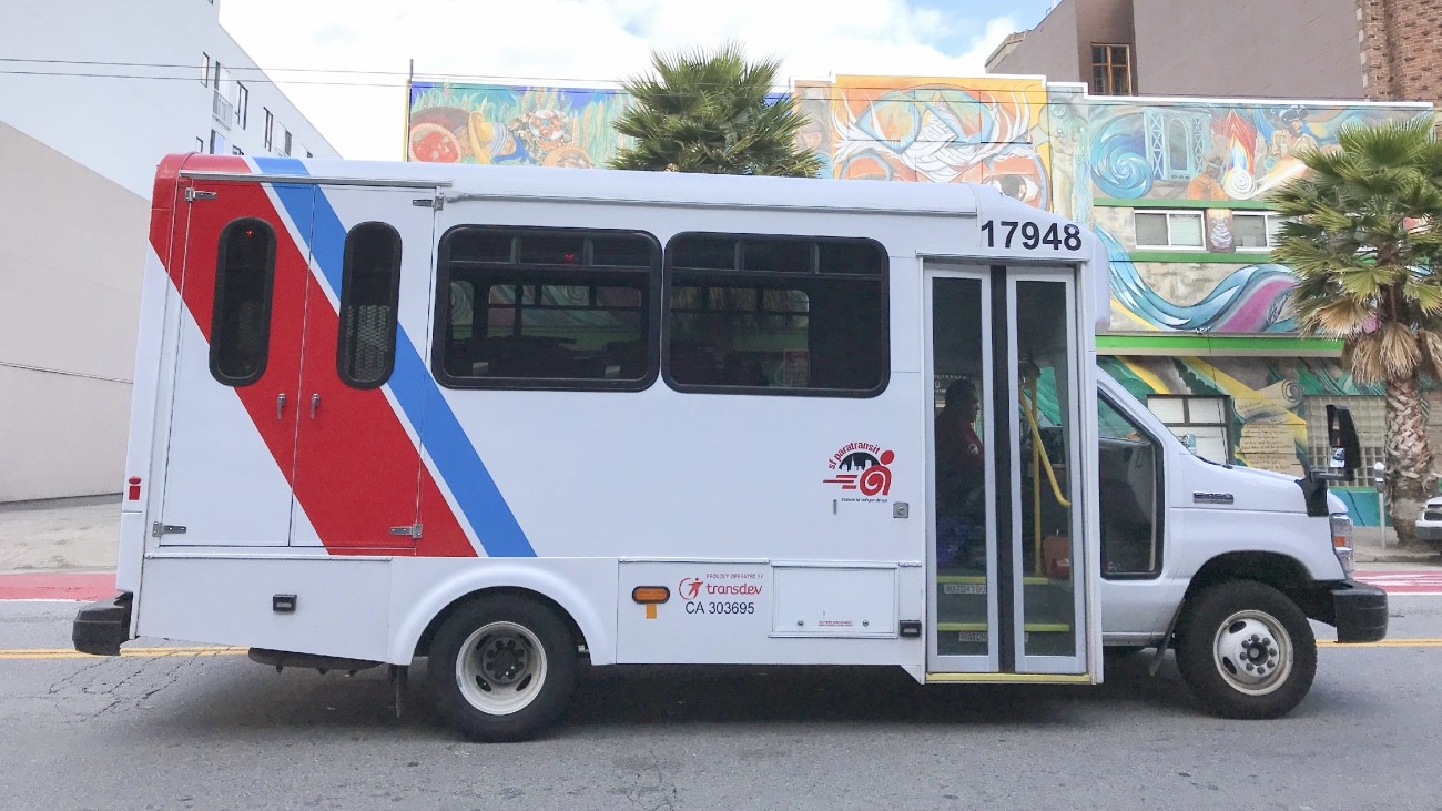 A paratransit vehicle on Mission Street near 14th Street.