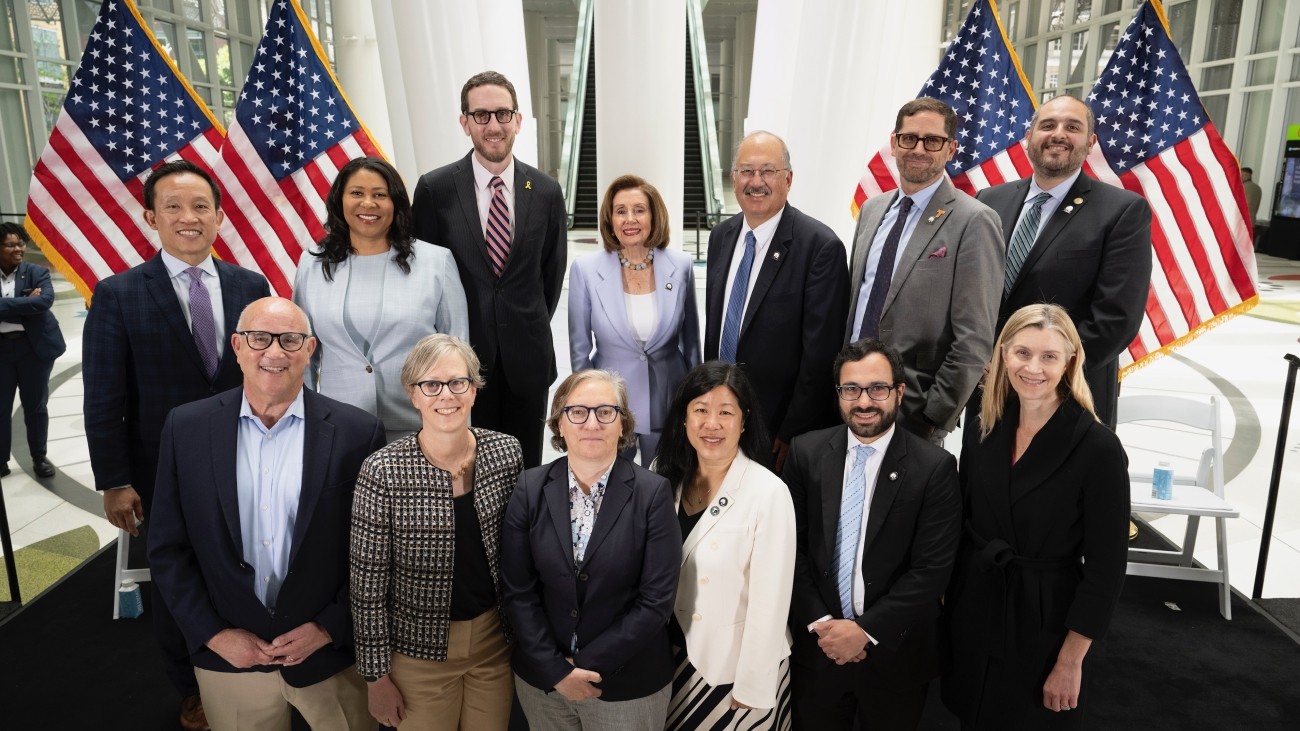 City leaders and transportation officials posing for a photo at the Salesforce Transit Center