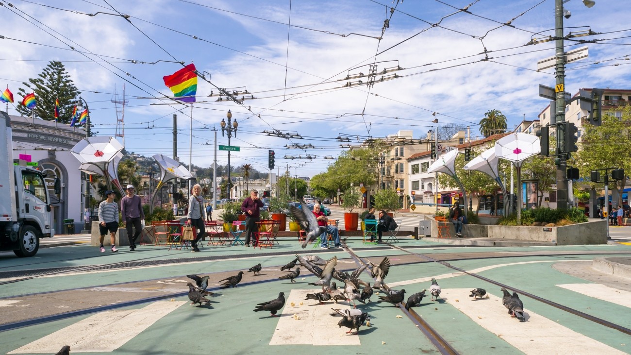 Pidgeon's in the foreground with pedestrians in the background at Jane Warner Plaza