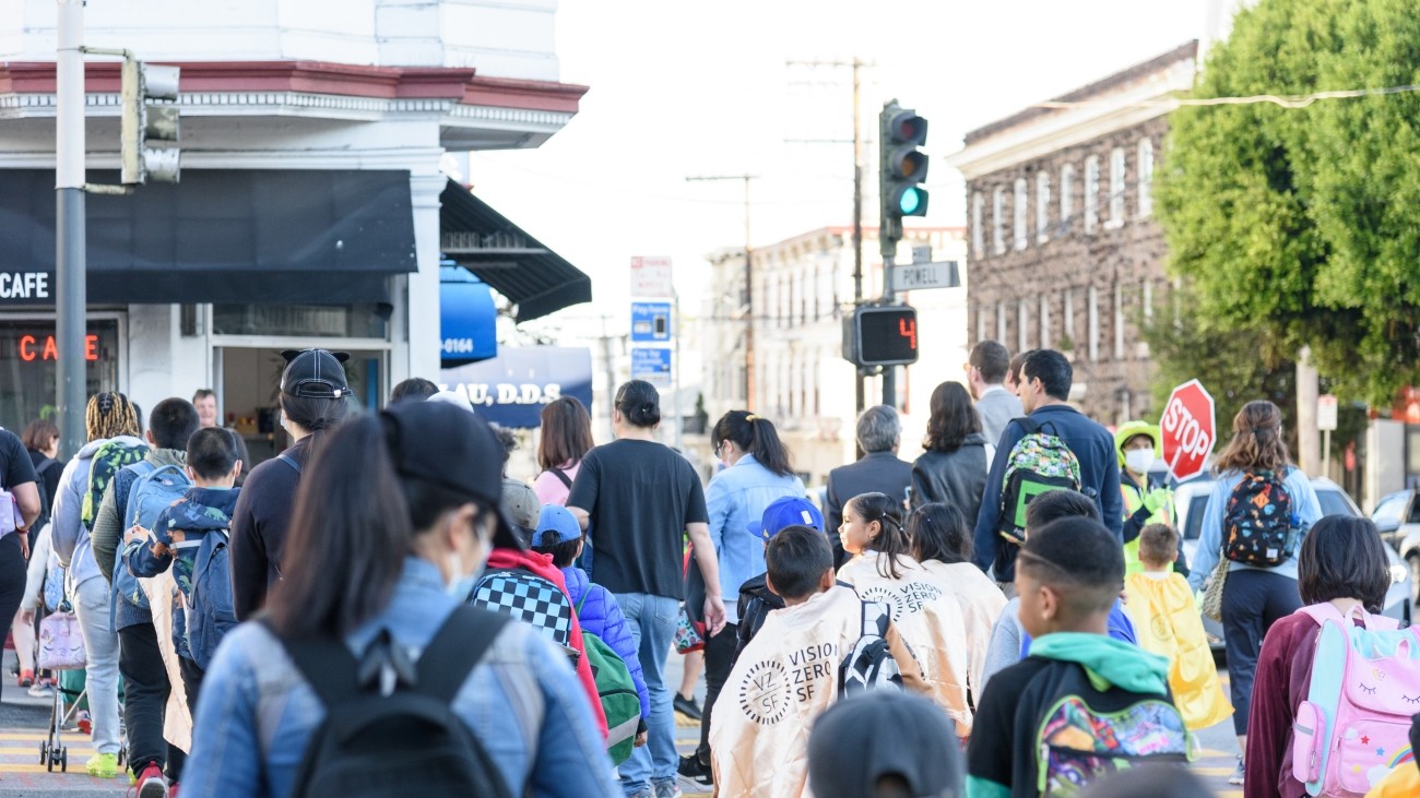 Group of students and parents crossing the street in Chinatown