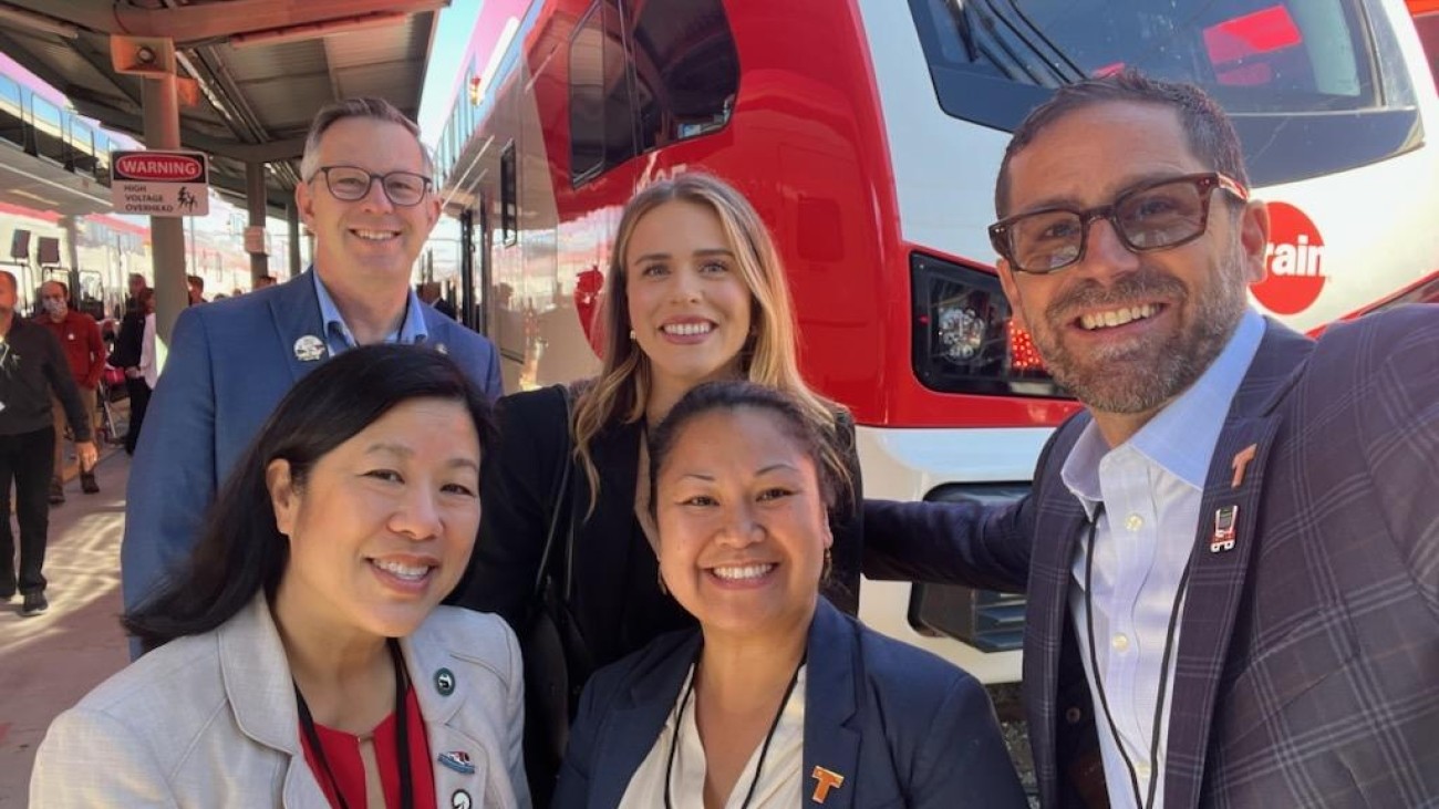 SFCTA Director with TJPA staff in front of Caltrain vehicle