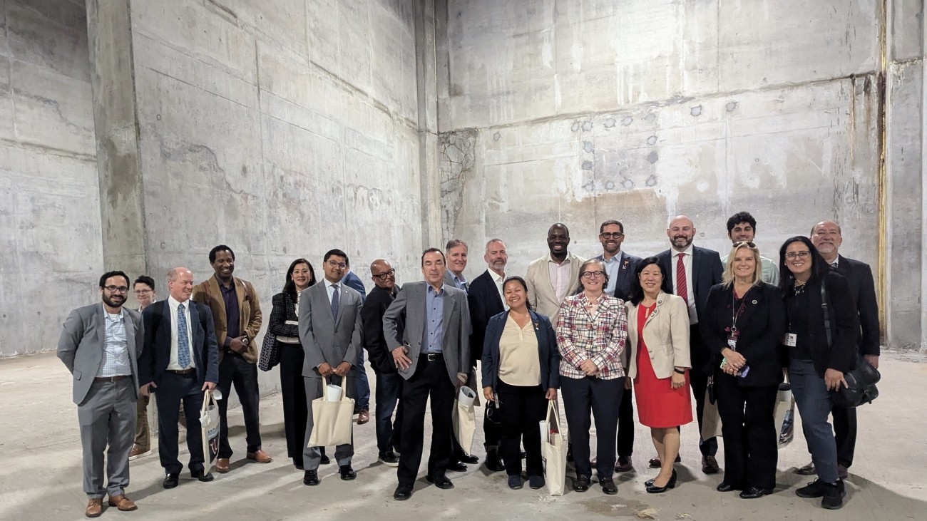 Transportation officials and staff standing for a group photo during tour ofthe Portal