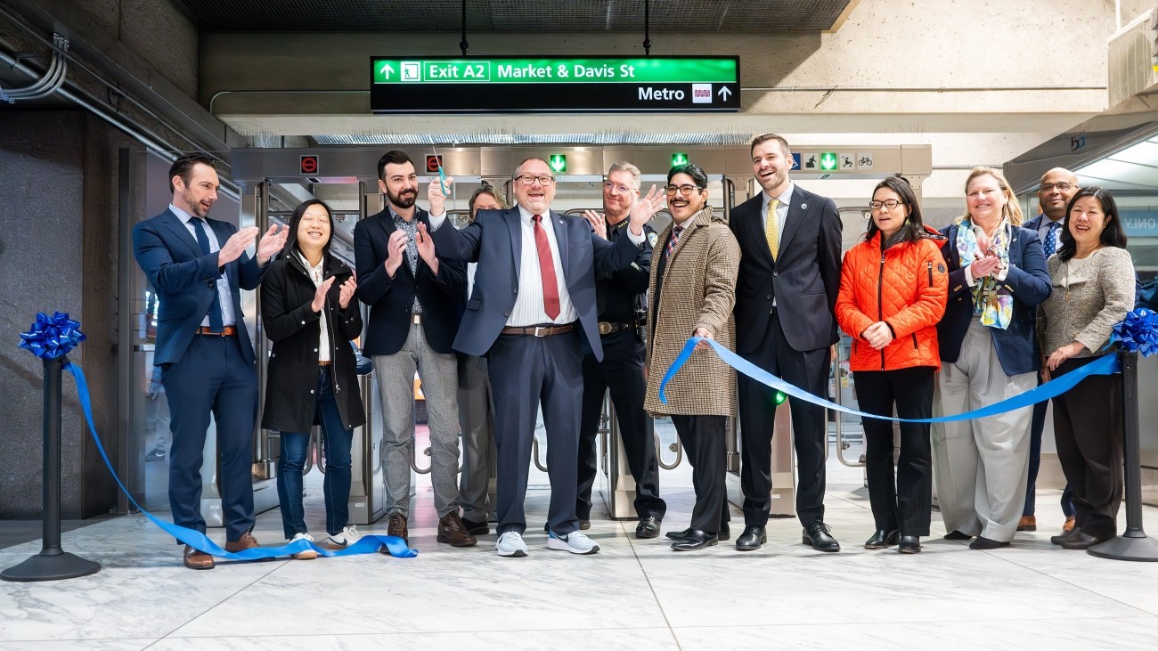 Staff from BART, SFCTA, SFPD cutting a ribbon