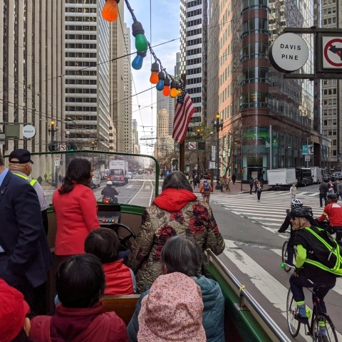 People riding the boat tram on car-free market street