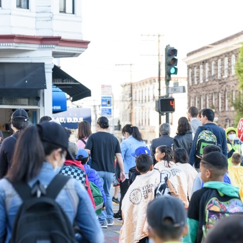 Group of students and parents crossing the street in Chinatown