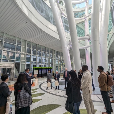 People standing around a speaker at the Salesforce Transit Center