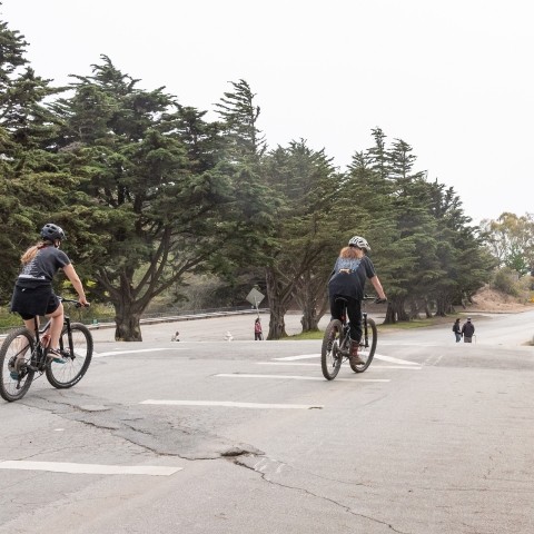 Cyclists using a multi-use path in McLaren Park