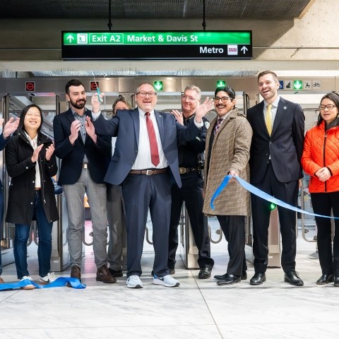 Staff from BART, SFCTA, SFPD cutting a ribbon